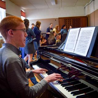 Student playing piano